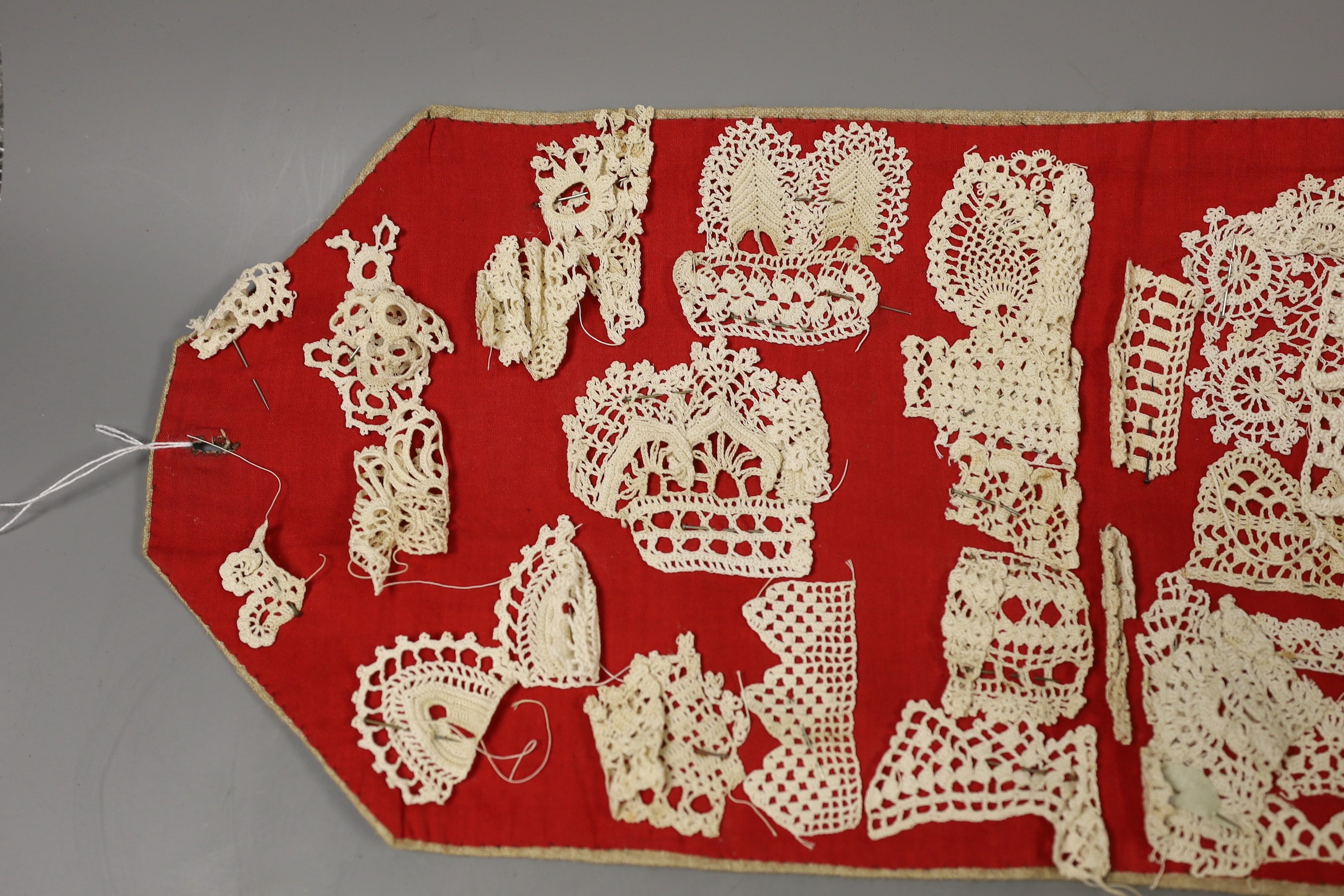 A collection of different crochet worked motifs and panels together with the DMC Library crochet work book